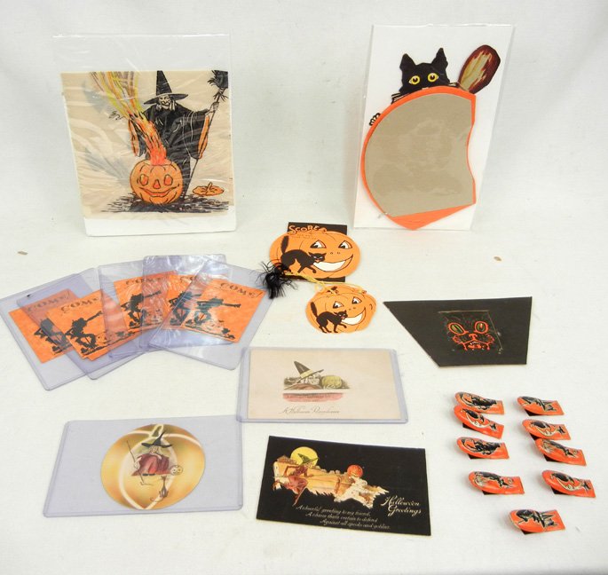 Grouping of early Halloween decorations,: Grouping of early Halloween decorations, including cat on honeycomb pumpkin, Witch with flaming pumpkin crepe paper, early Halloween postcard, Score pad with two Tallies, five Halloween party invitati