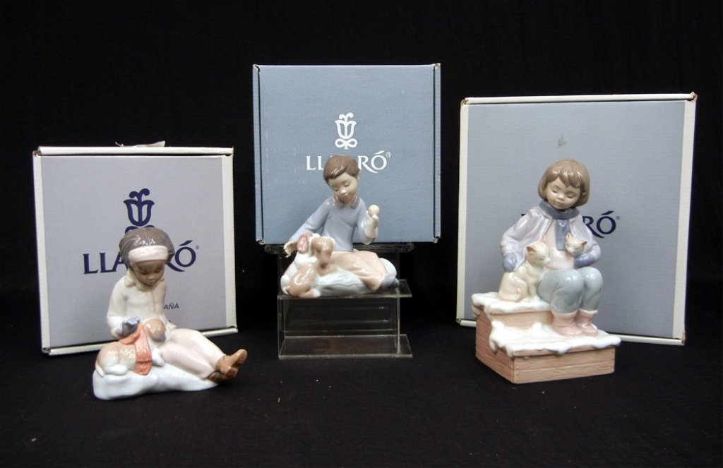 Grouping of three boxed Lladro figurines: Grouping of three Lladros, mint in boxes, including "Room for Three" No. 8023, "Are You Cold" No. 8169, and "Growing Up Together" No. 6983, largest box measures 9" x 8 1/4" x 5 1/2"