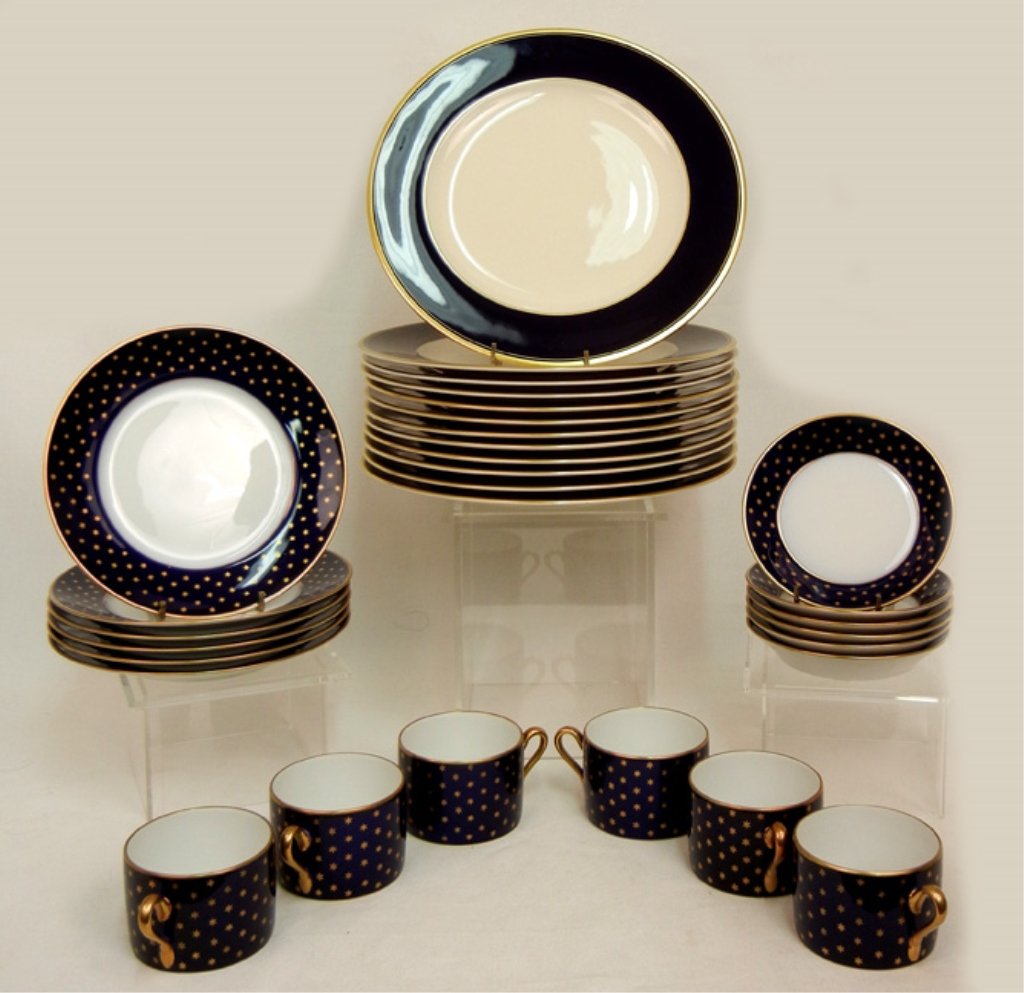 Richard Ginori eighteen piece set: Richard Ginori eighteen piece dinnerware set, service for six, cobalt with gold stars and trim, six flat cups, 2 1/4", six saucers 5 3/8", six bread plates 7 3/4", and twelve additional dinner plates