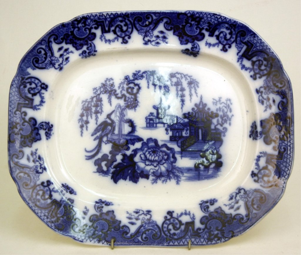 Bowess Stepan flow blue serving platter: Bowess Stepan flow blue serving platter, village scene with peacock, marked on back, 14 3/4" across