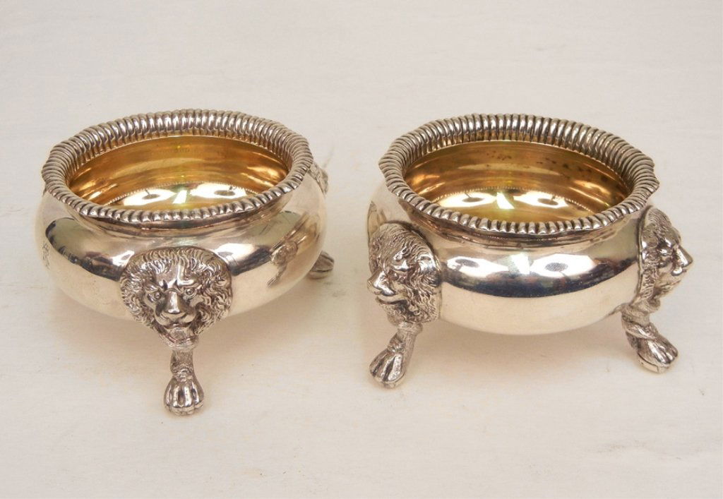 Pair of Charles Stuart Harris sterling master salts: Pair of Charles Stuart Harris, London, sterling silver master salts, three lions heads with paw feet, gold wash interior, marked on bottoms, engraved on front, 2 1/4" high x 4" across, 12.49 troy ounc