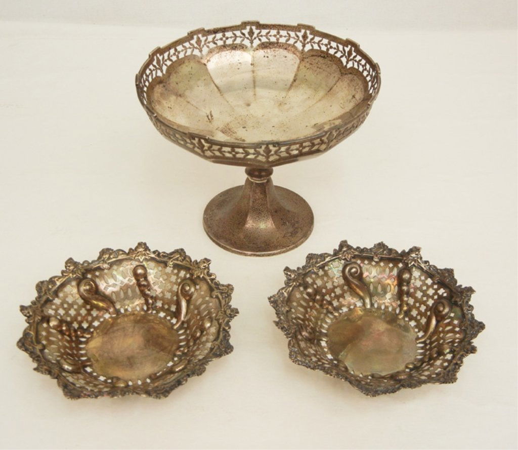 Three pieces of English sterling silver hollow ware: Pair of Mappin & Webb, Sheffield, pierced bowls, hallmarks on bottom and interior of bowl, ca. 1936, 4 3/4" across, and an Adie Bros. LTD, Birmingham sterling silver compote, pierced rim, makers mark