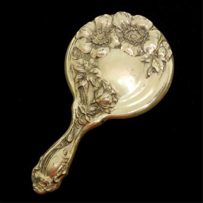 Art Nouveau sterling silver hand mirror: Repousse floral motif with beveled mirror, 9" long, marked Sterling P 1151, early 20th C.