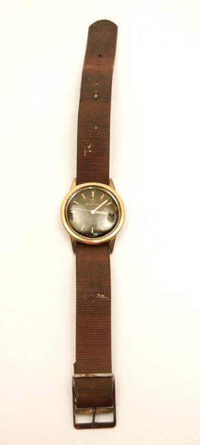 Man's Beyer Eterna-Matic wristwatch: Round gold plated case with black dial and date, 1 3/8" diameter, marked Eterna-Matic Beyer Swiss, adjustable fabric band, mid 20th C.