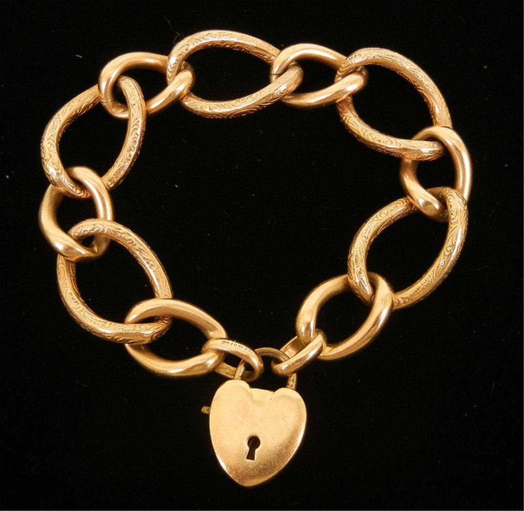 Edwardian gold filled charm bracelet: Fancy link chain bracelet with heart clasp engraved "Dick to Jane", 7 1/4" long, marked 1/20th 12k G.F., early 20th C.