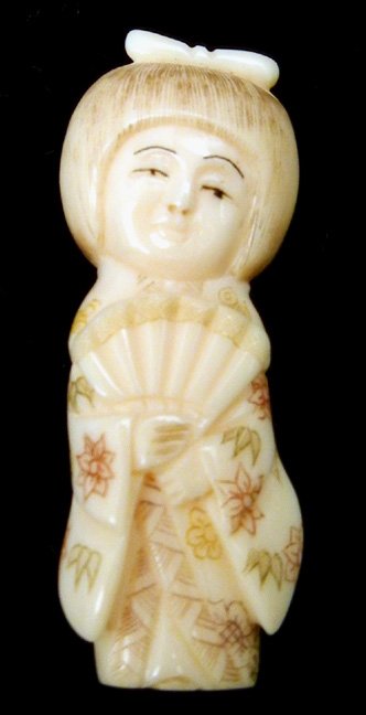 Hand carved ivory netsuke: Girl with fan, 2" high, hand colored, signed