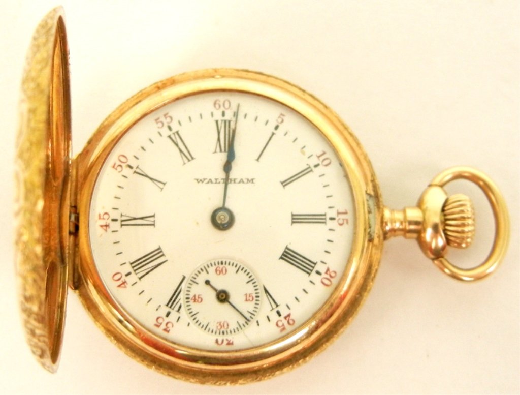 Lady's Waltham 14k gold cased pocket watch: Watch has hunting case with Art Nouveau chased design on front and back, 1 1/4" diameter, Roman numeral dial, marked 14k ROY, works marked A.W.W. Co. Waltham Mass. Sapphire 14170802, weight 21.7 grams