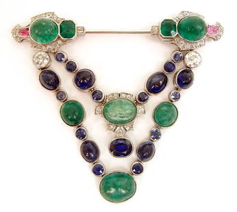 Art Deco platinum, diamond, emerald and sapphire brooch: 1920's platinum jabot style pin with double swag motif, overall size is 2 1/4" long x 2 1/8" wide, top portion is set on either end with two oval cabochon emeralds measuring 10mm long x 8mm wide x 3mm