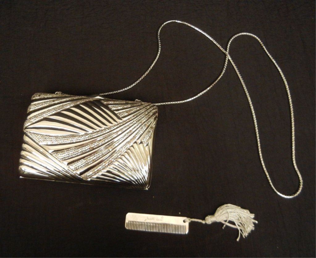 Judith Leiber silver rhinestone purse: Silver tone metal with mirrored stone accents, 6" long x 4 1/2" high, silver leather lining, chain handle with 20" drop, small comb with tassel, comb and purse marked Judith Leiber