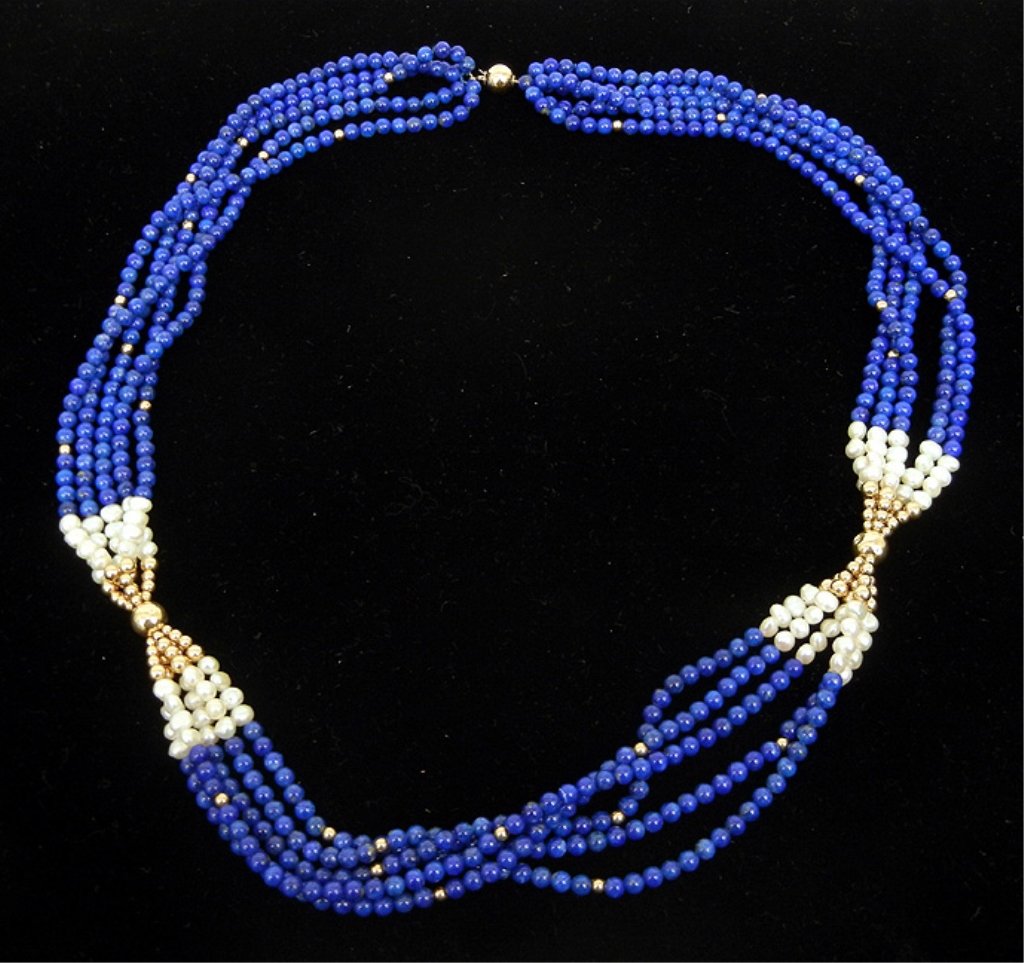 Sodalite, pearl and gold bead necklace: Five strand necklace comprised of sodalite beads measuring 4mm in diameter, 5mm freshwater pearls, and 14k gold beads and clasp, 24" long, clasp marked 14k, mid 20th C.