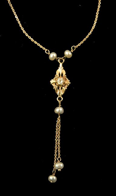 Gold, diamond and pearl drop necklace: Edwardian style 14k gold pendant on 16" fine link chain, ten 3mm pearls set at 1 1/4" intervals in chain, pendant set with one round diamond measuring approximately 0.12 carats, double chain drop with