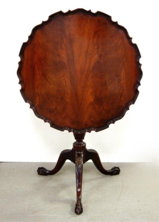 Mahogany piecrust tilt top table: Mahogany piecrust tilt top table, ball and claw feet, The Company Master Craftsman label on bottom, 29" high x 28 3/4"