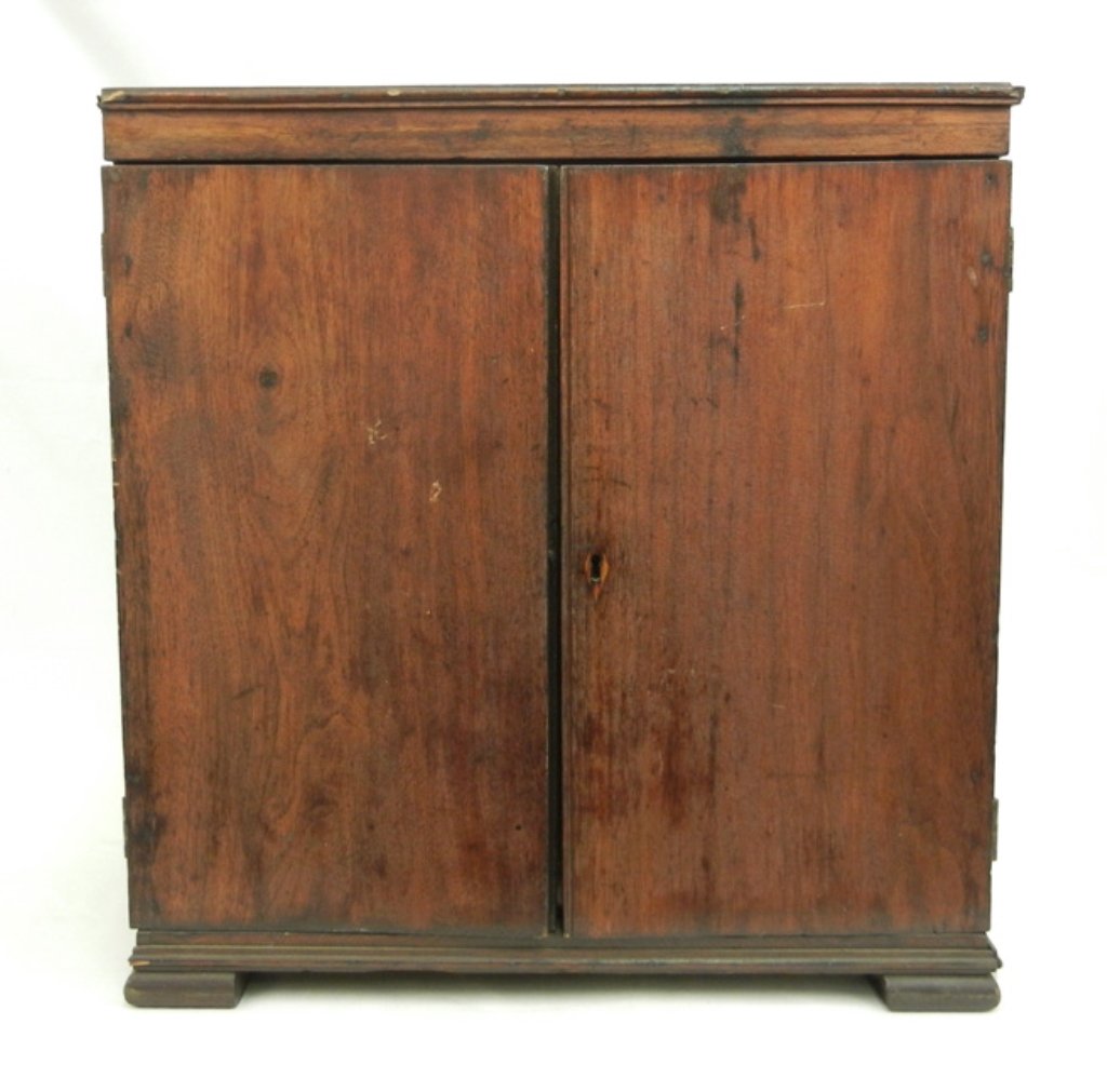 Walnut spice chest: Walnut spice chest, a pair of doors, one with diamond shaped inlaid escutcheon, fourteen interior graduated drawers, bracket feet, 18 3/4" high x 18" x 11", 19th C.