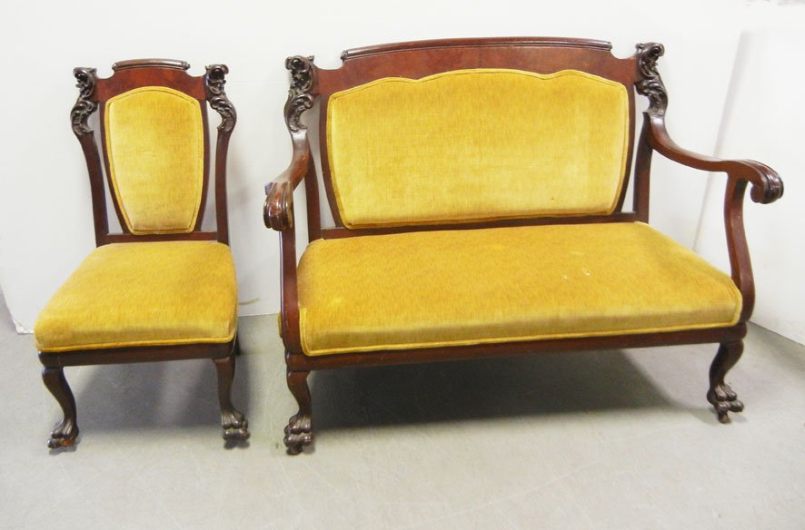 Rosewood two piece parlor set: Rosewood two piece parlor set, upholstered backs and seats, paw feet, on castors, settee 39” x 52” x 25”, side chair 38” x 19” x 20 ½”