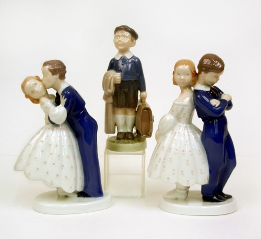 Three porcelain figurines, B&G and Royal Copenhagen: Three porcelain figurines, including two B&G figurines, No. 2162 Youthful Boldness, 7 1/2" high, and No. 2372 Pardon Me, 8" high, and Royal Copenhagen No. 4528 young male carrying briefcase, 6 3/4" hi