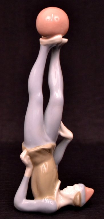 Royal Dux figurine: Royal Dux figurine, circus performer balancing ball on feet, marked on bottom, 8 1/2" high