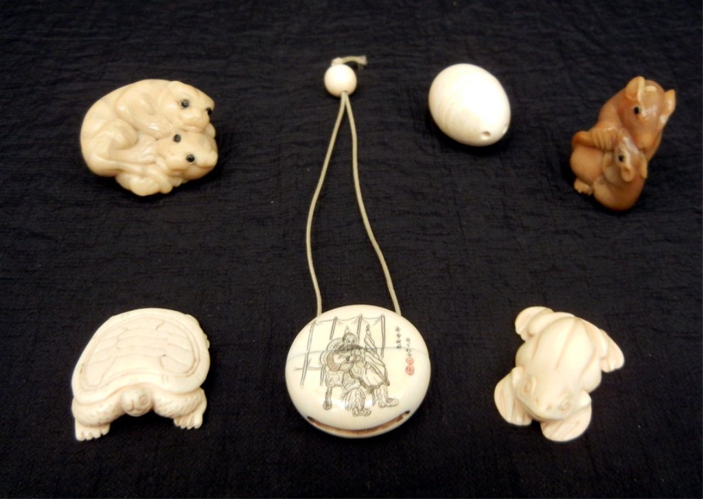 Grouping of miniature ivory netsukes: Grouping of miniature ivory carved netsukes, including mother and baby rat, two lions, a turtle, and a frog, signed on bottom, small round snuff box, one side with figural design, reverse with butterf
