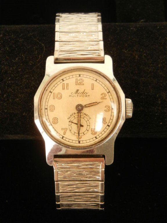 Mido Multifort wristwatch: Mido Multifort Super-Automatic Wristwatch, waterproof stainless steel case, 1 1/8" diameter, Speidel stretch band, mid 20th C.