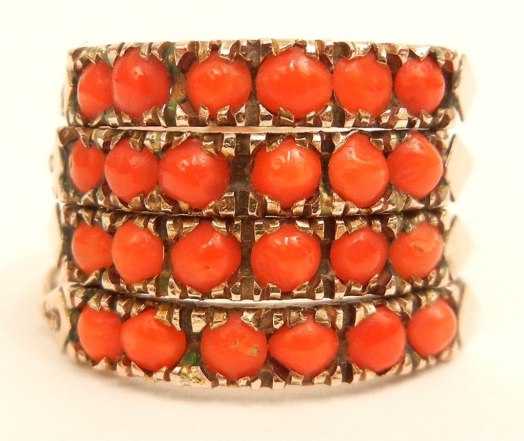Gold and coral stack ring: 14k gold and coral stack ring, four rings each set with six round channel set coral, 5/8" wide at center, size 6 3/4, unmarked, tests 14k, weight 3.7 grams/2.4 dwt, mid 20th C.