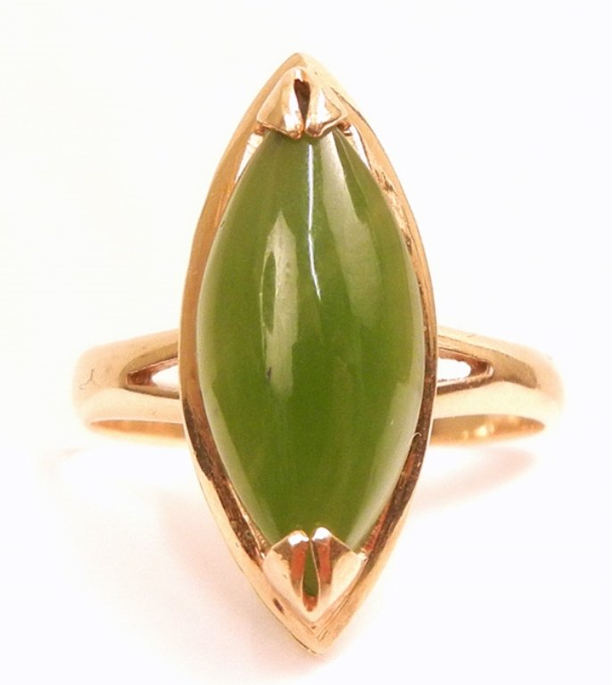 Gold jade ring: 14k gold and jade ring, one marquise shaped green jade stone measuring 15mm long x 7mm wide, size 5 1/2, marked 14k Taiwan, weight 2.8 grams/1.8 dwt, mid 20th C.