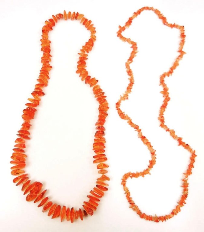Amber and carnelian bead necklaces: Two beaded necklaces, one amber, 30" long, amber nuggets measuring between 1/3" to 1 1/4" long; and one comprised of carnelian, 37" long, comprised of carnelian pieces approximately 1/4" in diameter, 
