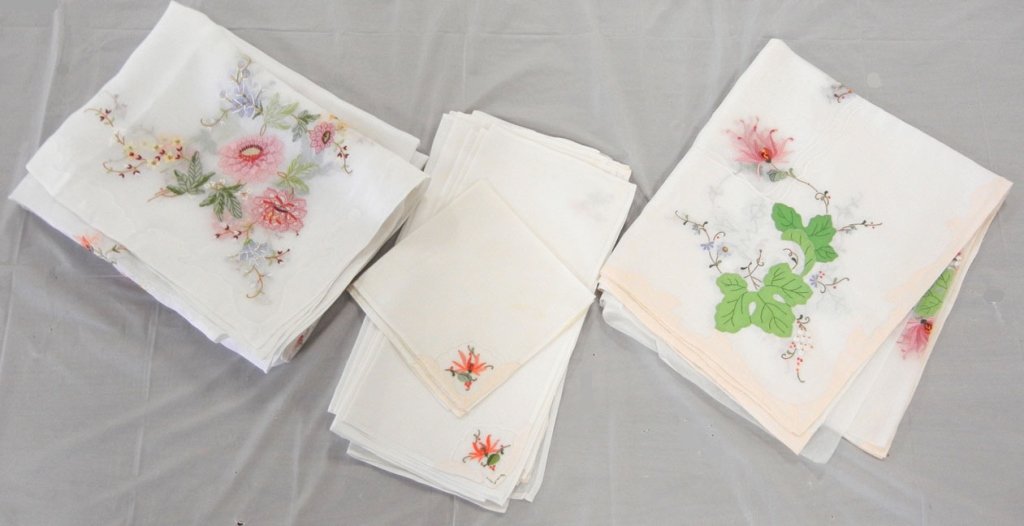 Two Madeira tablecloth sets: Two Madeira organdy tablecloth sets with embroidery and applique including one set with pale peach border, tablecloth measures 102" long x 66" wide with twelve matching napkins 16" x 16", and one set