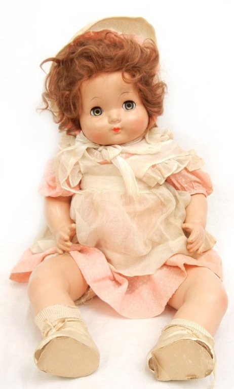 Large Effanbee compo and cloth doll: Large Effanbee composition and cloth doll, 24" high, blue flirty eyes, painted and applied lashes, painted closed mouth, wearing dress with matching bonnet, underslip, socks and shoes, marked on head