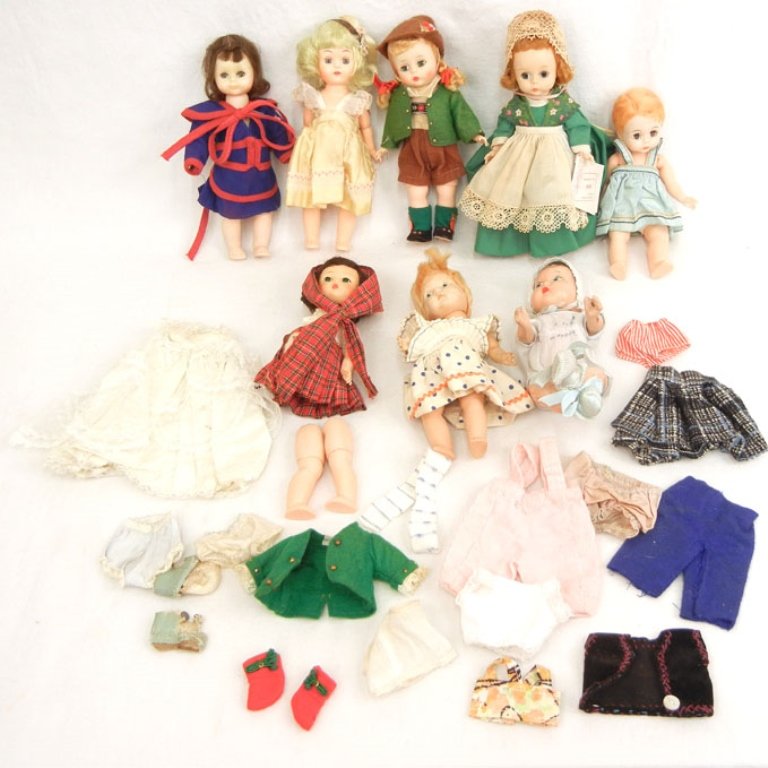 Grouping of hard plastic dolls: Grouping of hard plastic dolls, 7"-8", including Madame Alexander, strung Ginny, Virga, and a composition Quint doll, with additional clothes, 1940's-50's, eight dolls total