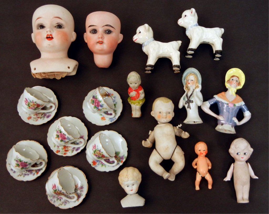 Small grouping of assorted dolls: Small grouping of assorted dolls, including bisque heads, dolls, pin cushion dolls, doll size teacups and saucers marked Japan, bisque head "Made in Germany, Floradora, A 2/0 M", Fulper bisque shoulde