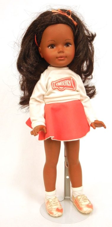 1970's-80's black Kimberly doll: 1970's-80's black Kimberly doll by Tomy, all original, wearing cheerleading outfit, underwear, socks, and shoes, with ribbon in hair, marked on back of head, 16" high