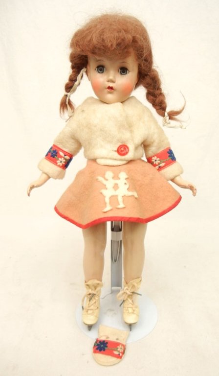 R&B hard plastic Ice Skater: R&B hard plastic Ice Skater, wearing original outfit with jacket attached to dress, underwear, and ice skates, one glove, blue sleep eyes, painted and applied lashes, marked R&B on head, 14" high