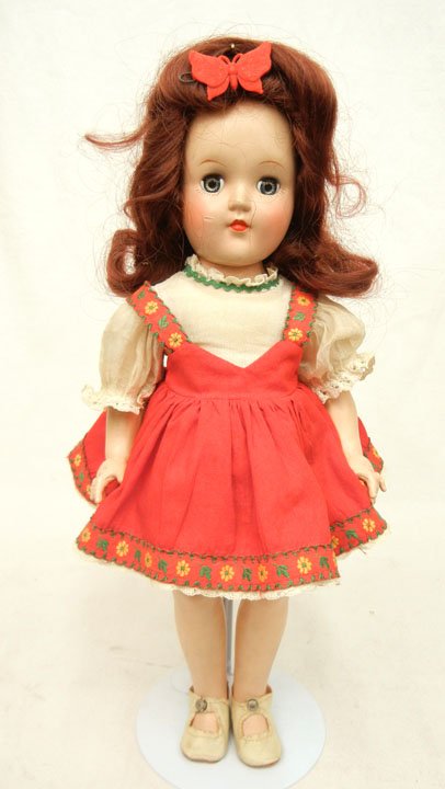 Ideal Toni doll: Ideal Toni doll, 14", hard plastic, blue sleep eyes, painted and applied lashes, wearing factory outfit, slip, underwear, and center snap shoes, marked on head and back