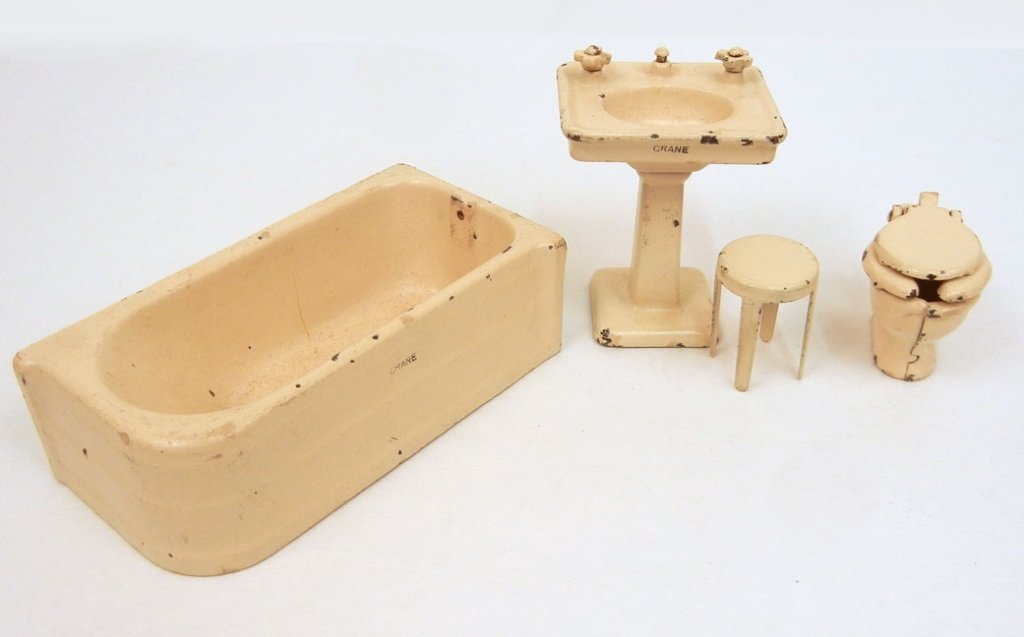 Arcade cast iron Bathroom set: Arcade cast iron Bathroom set, including bath tub, sink, toilet, and stool, all marked Arcade, tub, toilet, and sink marked "Crane"