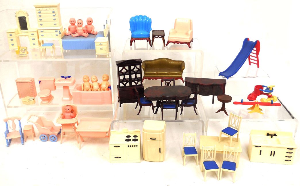 Grouping of Renwal and Ideal doll furniture: Grouping of Renwal and Ideal doll furniture, including Ideal bedroom set, table and chairs, kitchen appliances, dining room set, and Renwal bathroom set, play set, nursery items, high chair, two armch