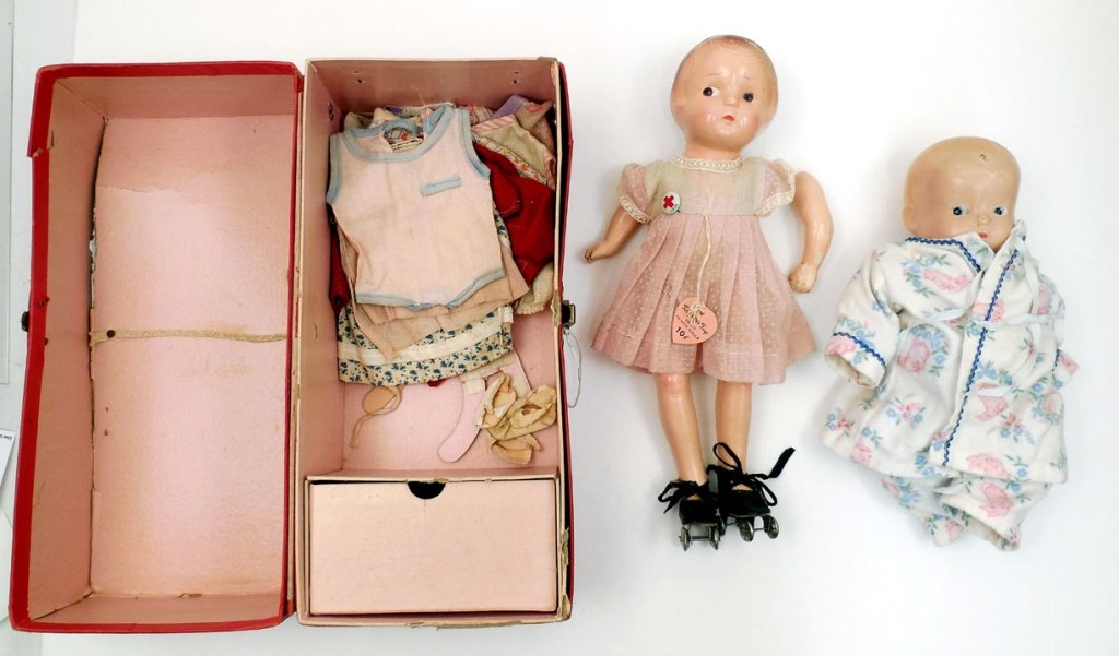 Two composition dolls: Two composition dolls, 12" composition doll, unmarked, painted features and molded hair, wearing dress with hang tag "Totsy Doll Toys", roller skates, red cross 1936 pin on dress, composition in great
