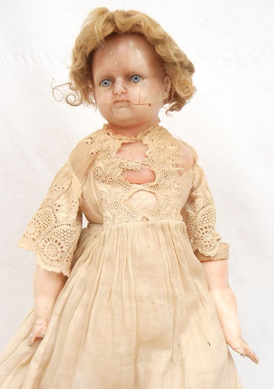 Antique shoulder head wax doll: Antique shoulder head wax doll, wax poured over composition, arms and legs, cloth stuffed body, with blue glass sleep eyes, antique wig, wearing dress with two slips, socks and leather shoes, 22 1/2" 