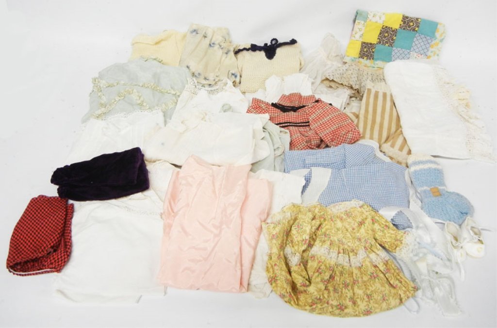 Grouping of antique and vintage doll clothing: Grouping of antique and vintage doll clothing, baby doll sizes, dresses, skirts, sweaters, slips, whites, blanket, socks, and more