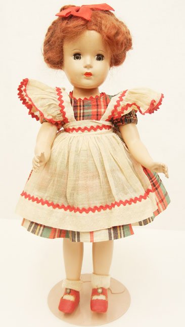 1949-50 Vogue hard plastic Mommy & Me series: 1949-50 Vogue hard plastic Mommy & Me series doll, 14", all original, tagged dress, sleep eyes, painted and applied lashes, marked on back "Made in USA", Vogue made a matching 8" Ginny doll