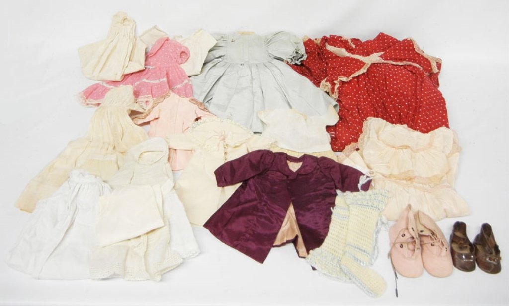 Grouping of antique and vintage doll clothes: Grouping of antique and vintage doll clothes, including a large red dotted dress fits 42" doll, various sizes