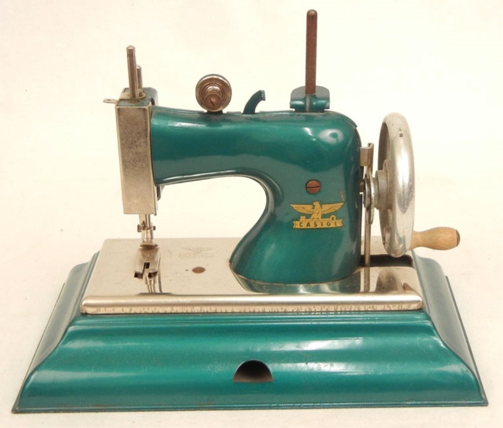 Casige child's sewing machine: Casige child's sewing machine, Made in Germany British Zone, maker's mark, solid teal color, 6 3/4" x 8 5/8" x 5"