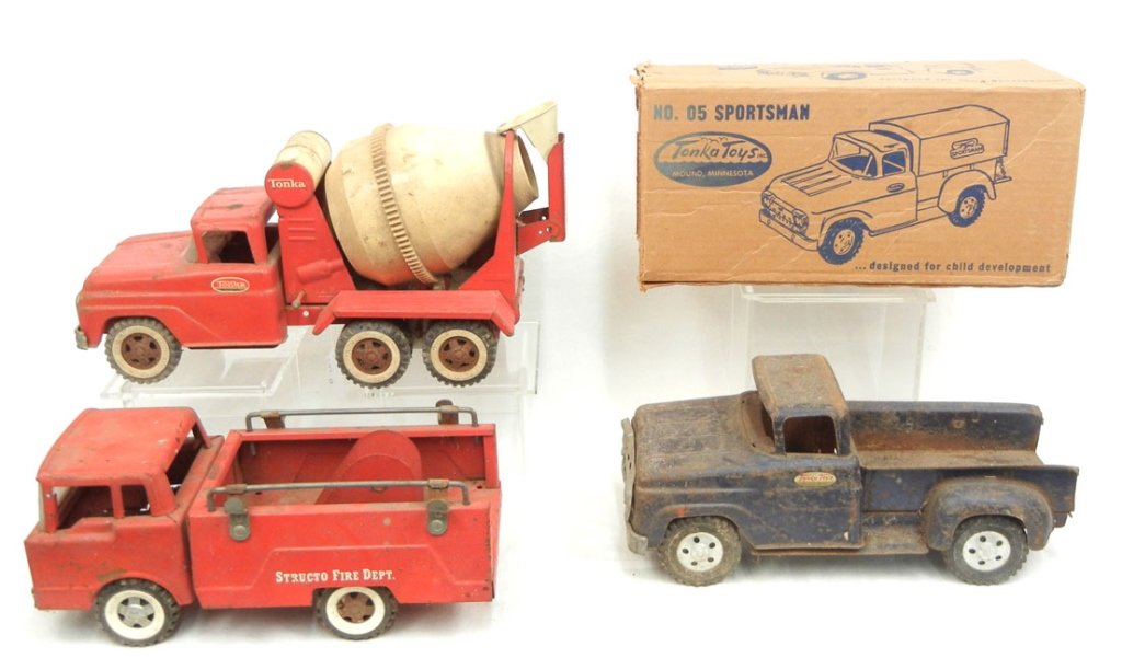 Three pressed steel trucks: Three pressed steel trucks, Tonka No. 5 Sportsman with original box, 12 3/4" long, Tonka Cement truck 16" long, and a Structo Fire Rescue truck 12"