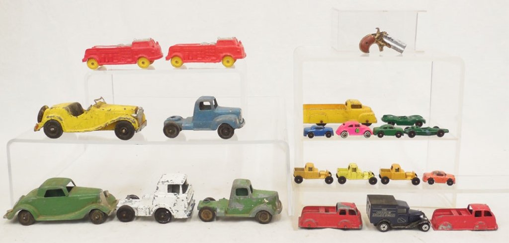 Grouping of diecast and rubber cars: Grouping of diecast and rubber cars, includes Tootsietoy, Hubley and Auburn Rubber Co., two fire trucks, twenty total, small diecast gun, Hubley Kiddie 432 and Hubley 404