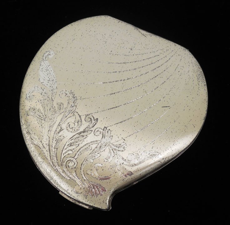 Sterling silver compact: Lady Elgin sterling silver compact, stylized heart motif, 3 3/8" long x 3 1/4" wide, marked inside Lady Elgin Sterling Made in U.S.A., ca. 1940