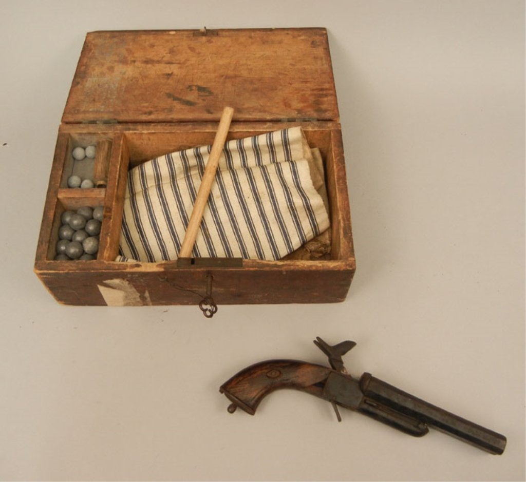 19th C. double barrel pin-fire pistol: 19th C. double barrel pin-fire pistol, no maker's mark or serial number, approximately .54 cal., comes in wooden box with some lead balls, barrel length 5", overall length 10", C&R Yes, Background che
