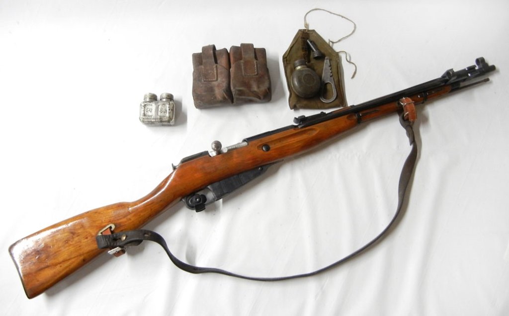 Mosin-Nagant Russia military 7.62 x 54-R rifle: Mosin-Nagant Russia military 7.62 x 54-R rifle, bolt action, Model M44, internal magazine feed, dated possibly 1936, serial number AH4506, barrel length 21", overall length 40 1/4", with leather sling
