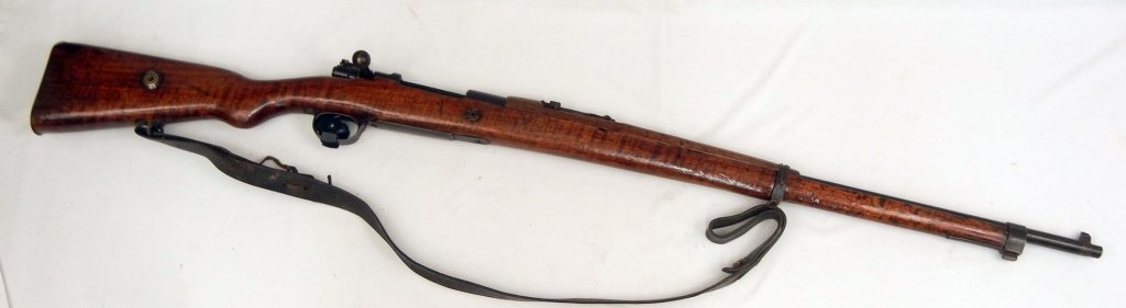 Turkish Mauser military 8mm rifle: Turkish Mauser military 8mm rifle, bolt action, 5 shot, Model M38 Mauser type, internal magazine feed, dated 194?, serial number 118662, barrel length 29 1/2", overall length 49", with leather sling, 