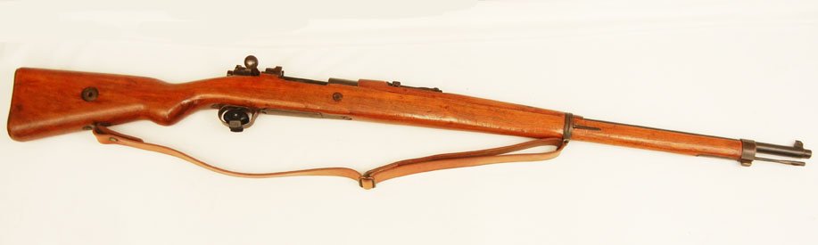 Turkish Mauser military 8mm rifle: Turkish Mauser military 8mm rifle, bolt action, 5 shot, Model 1912 Mauser type, internal magazine feed, dated 1940, serial number 43566, barrel length 29 1/2", overall length 49 1/2", with leather sli