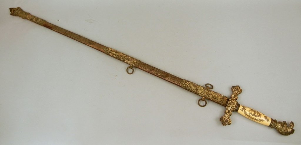 Ornate Knights of Columbus sword with scabbard: Ornate Knights of Columbus sword with scabbard by The Pettibone Bros. Mfg. Co., Cincinnati, Ohio, blade is ornately etched with name "Ben F. Allen" on one side of the blade, bone engraved handle with 