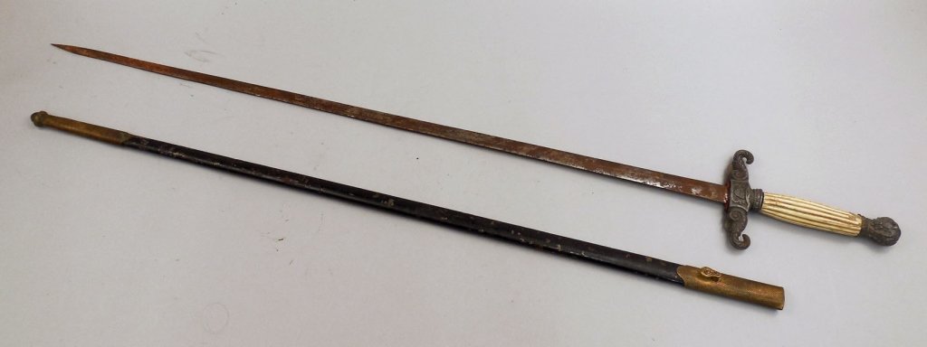 Model 1840 Militia Civil War sword in scabbard: Model 1840 Militia Civil War sword in scabbard, round pommel and crossguard decorated with an eagle and a U.S. shield, bone handle, blade measures 28 1/2" long, overall 35 3/4" long