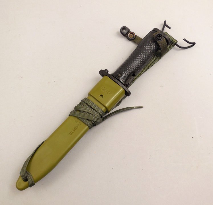 Korean K-M5A1 bayonet in sheath: Korean K-M5A1 bayonet in sheath, crossguard impressed K-M5A1, and an 8 symbol, sheath marked M10, 19204, ASSY 844876, MFG 1Z803, blade is 6 3/4" long, overall 12 1/4" high